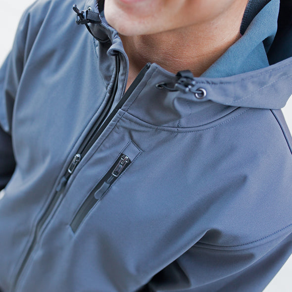 Close up of zippers and pockets of the tech jacket.